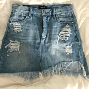 BEBE light denim distressed jean skirt